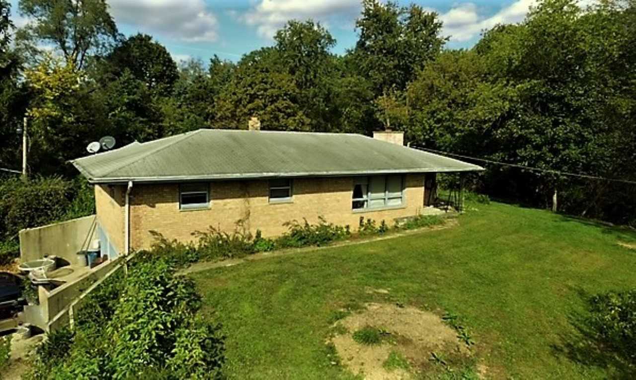110 Lovesee Road Roscoe, IL 61073 - Photo 2 of 25 a view of house with backyard