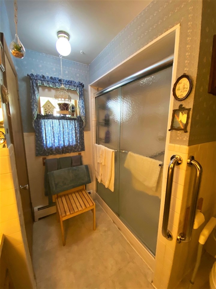110 Lovesee Road Roscoe, IL 61073 - Photo 22 of 25 a bathroom with a window and shower