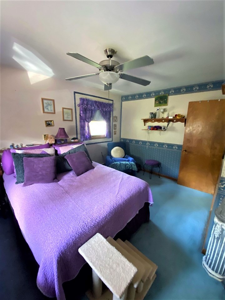 110 Lovesee Road Roscoe, IL 61073 - Photo 23 of 25 a bed room with a bed and a fish tank