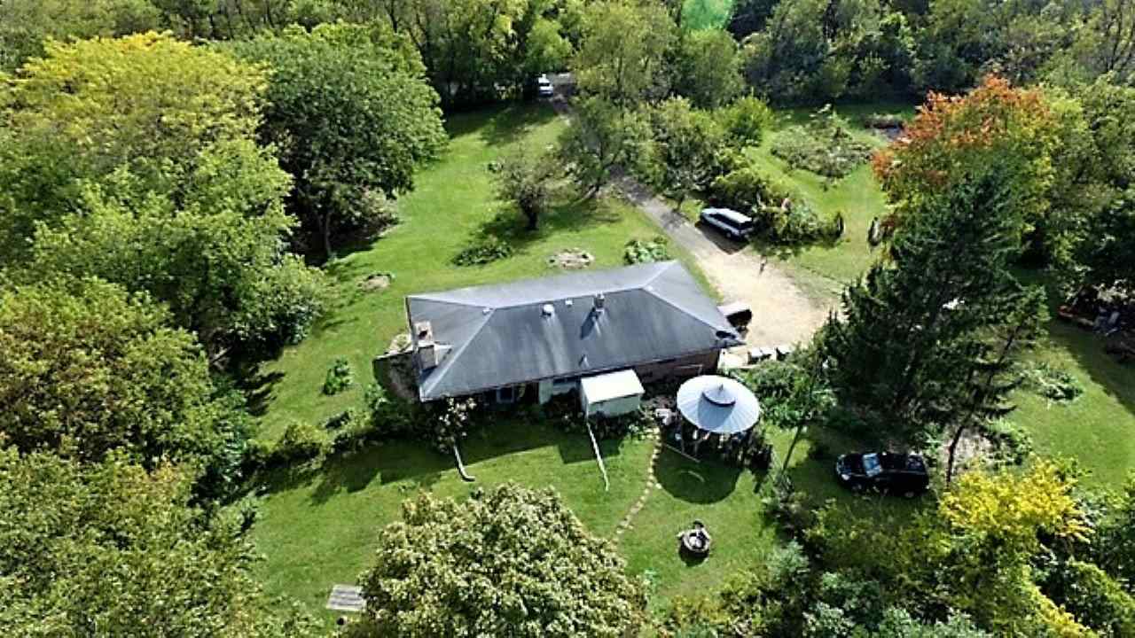 110 Lovesee Road Roscoe, IL 61073 - Photo 5 of 25 a backyard of a house with yard and outdoor seating
