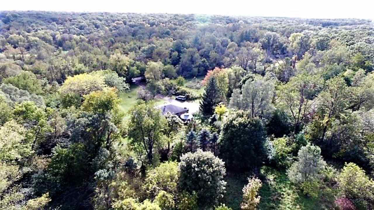 110 Lovesee Road Roscoe, IL 61073 - Photo 10 of 25 a view of a city with lush green forest