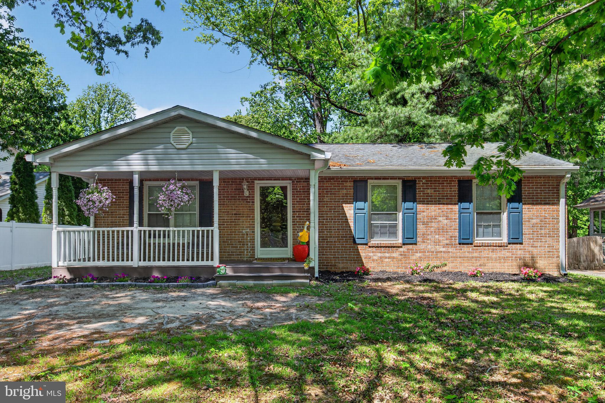11789 Little Cove Point Road Lusby, MD 20657 - Photo 1 of 16 front view of a house with a yard
