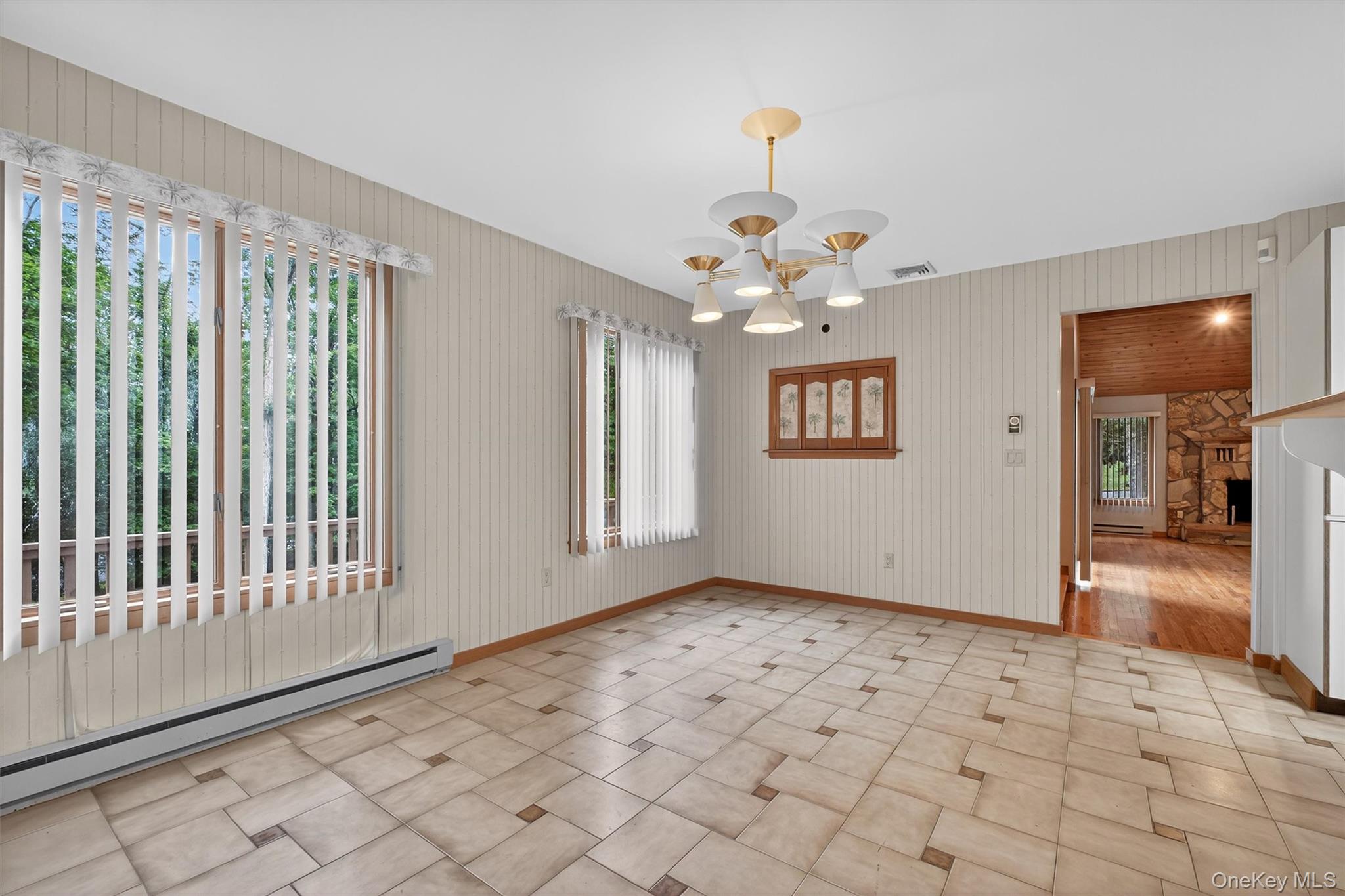 35 Greenlawn Road Amawalk, NY 10501 - Photo 11 of 50 a view of an empty room with window and chandelier fan