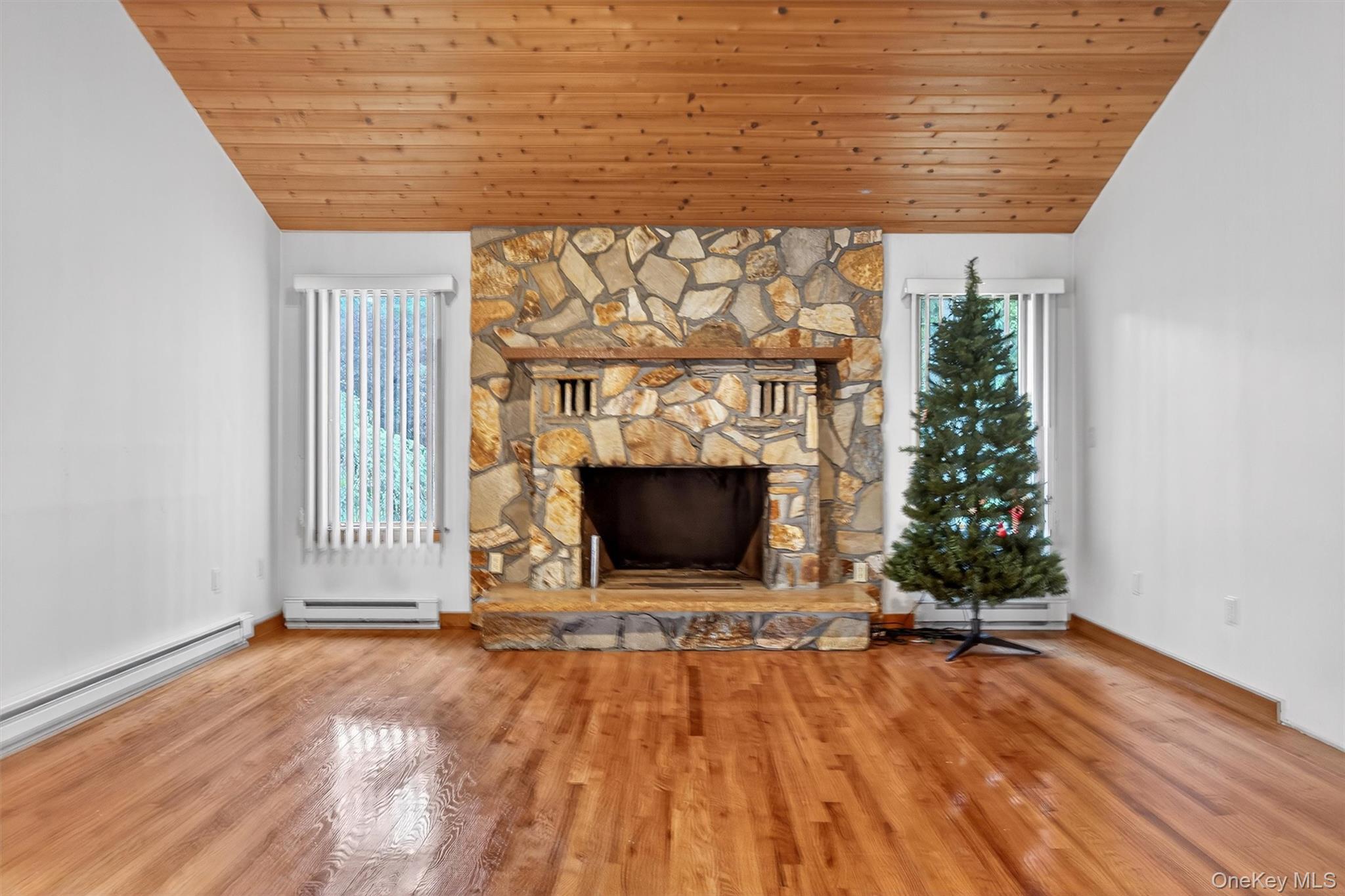 35 Greenlawn Road Amawalk, NY 10501 - Photo 17 of 50 a view of a livingroom with wooden floor and a fireplace