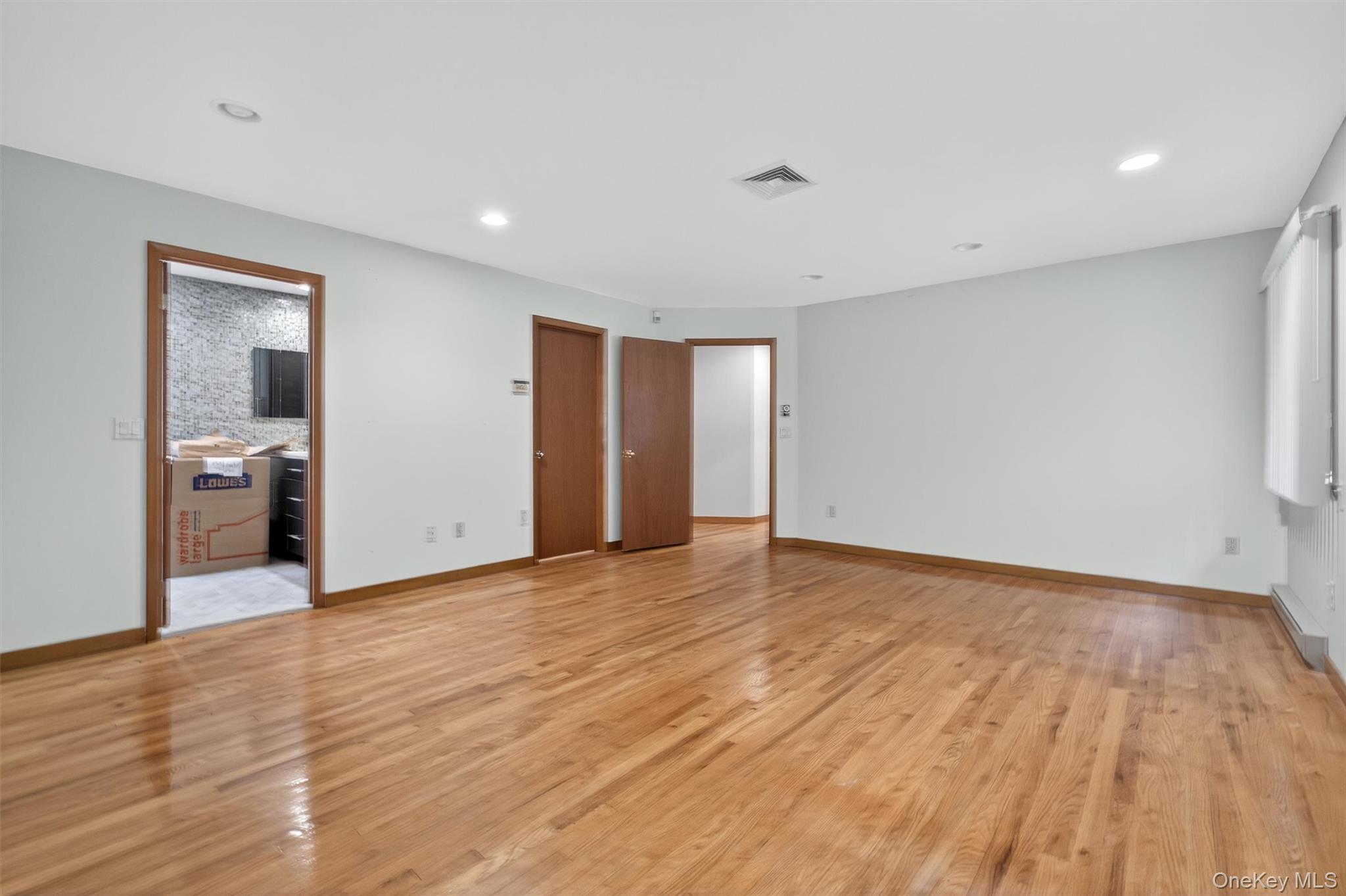 35 Greenlawn Road Amawalk, NY 10501 - Photo 20 of 50 a view of an empty room with wooden floor and a window