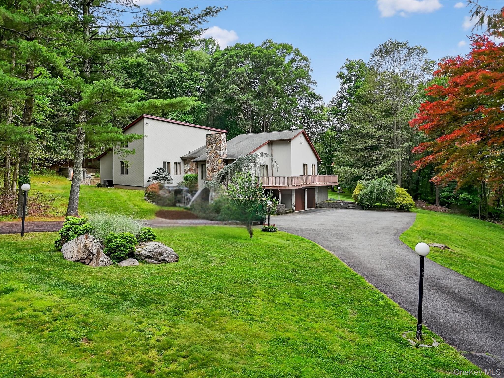 35 Greenlawn Road Amawalk, NY 10501 - Photo 2 of 50 a front view of a house with garden