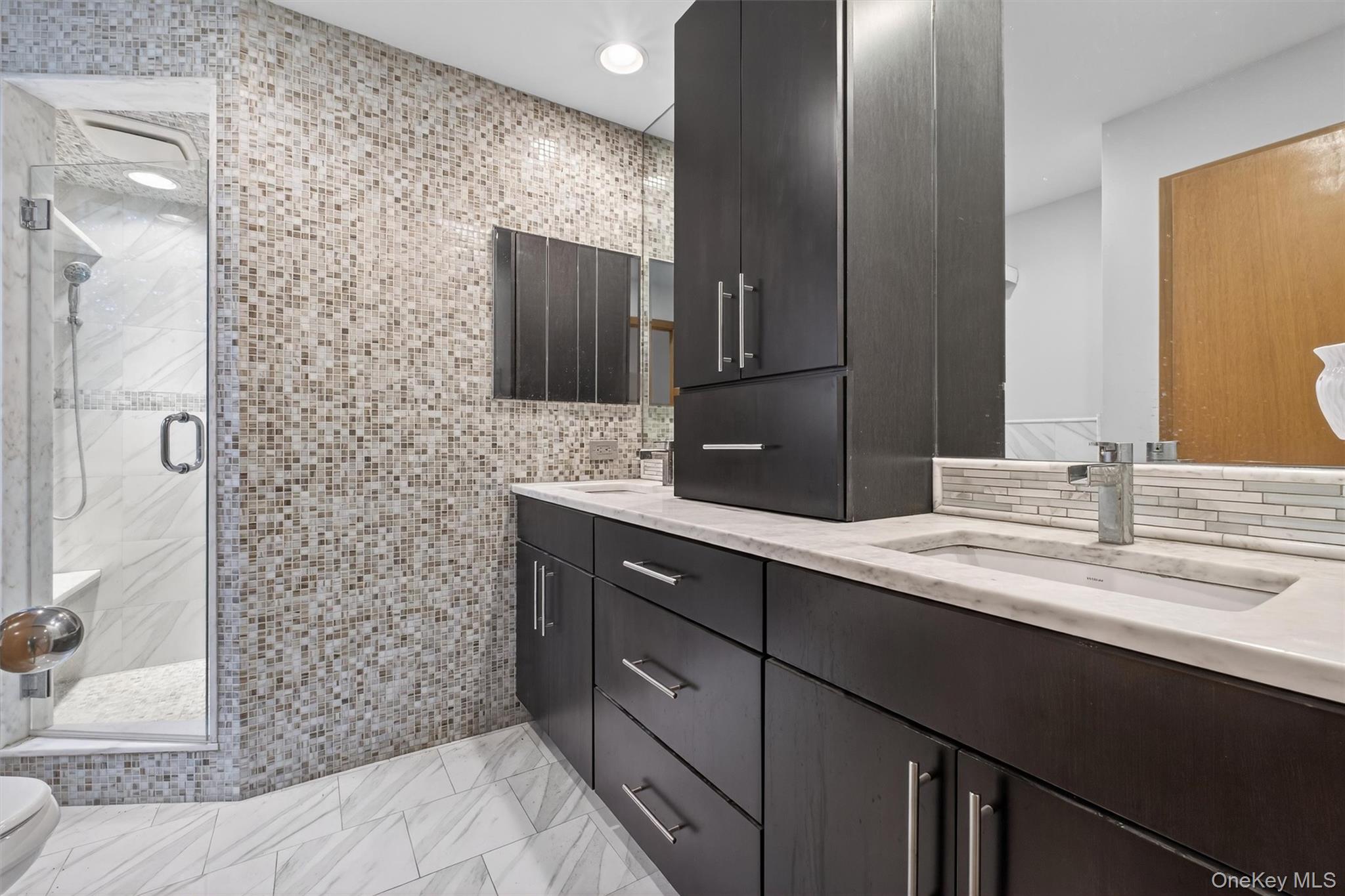 35 Greenlawn Road Amawalk, NY 10501 - Photo 22 of 50 a bathroom with a double vanity sink and mirror