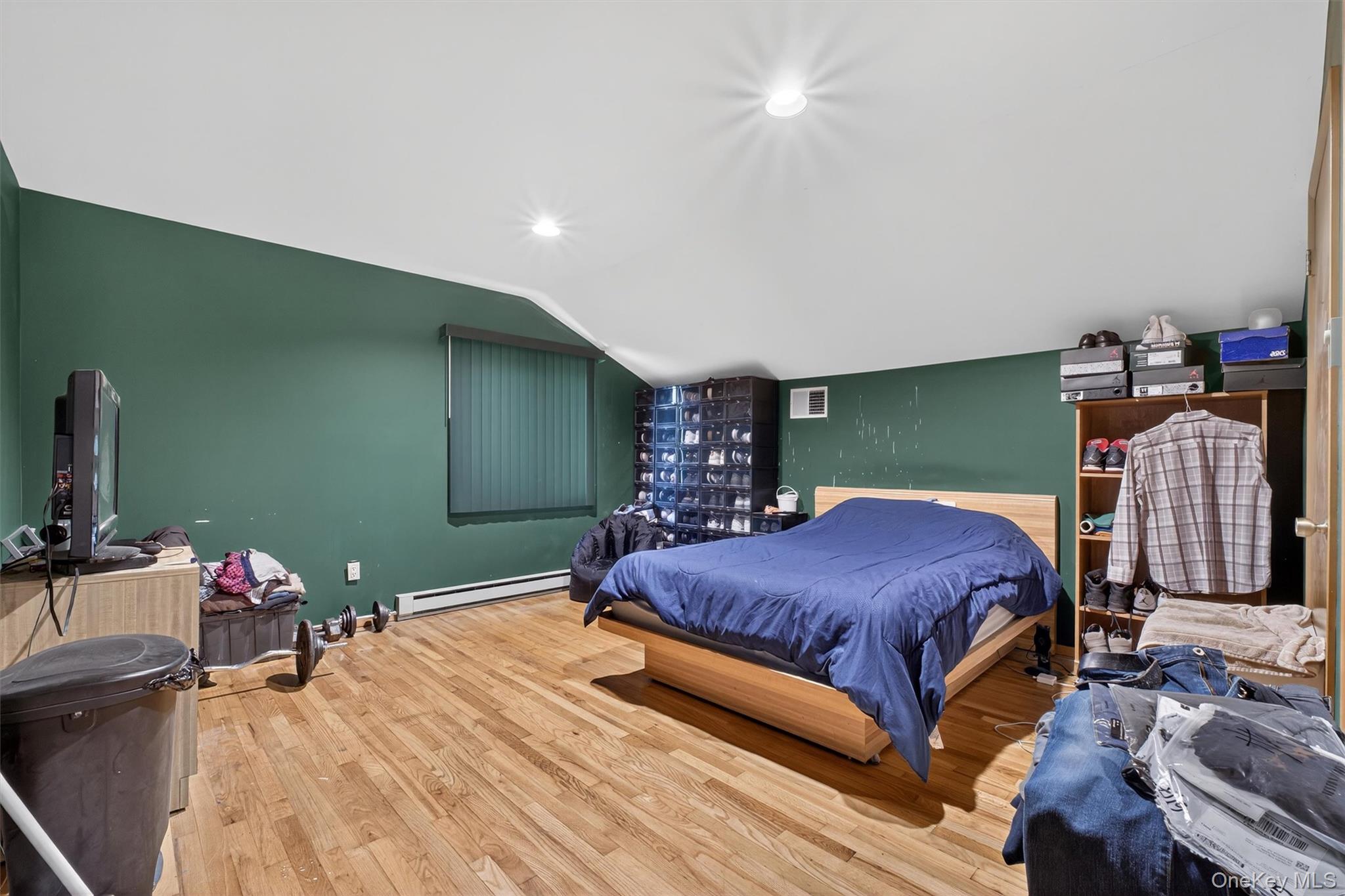 35 Greenlawn Road Amawalk, NY 10501 - Photo 26 of 50 a bedroom with a bed and a chandelier