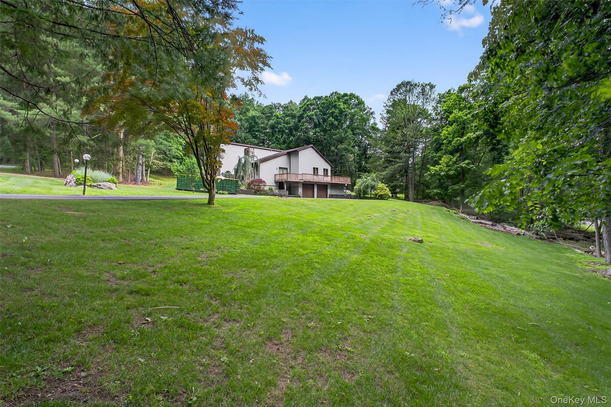 35 Greenlawn Road Amawalk, NY 10501 - Photo 42 of 50 a view of a big yard with a house in the background