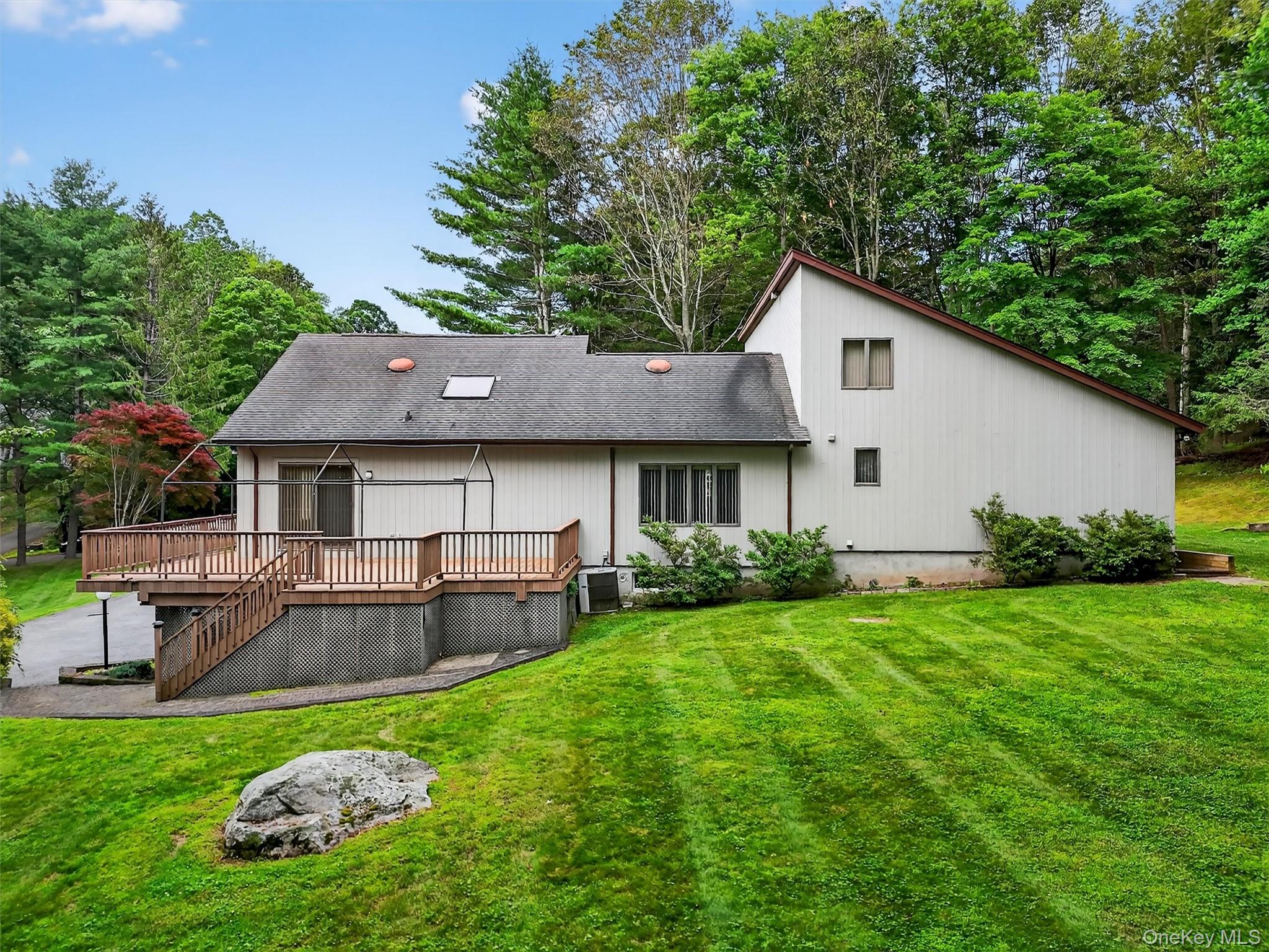 35 Greenlawn Road Amawalk, NY 10501 - Photo 43 of 50 a aerial view of a house with pool and chairs
