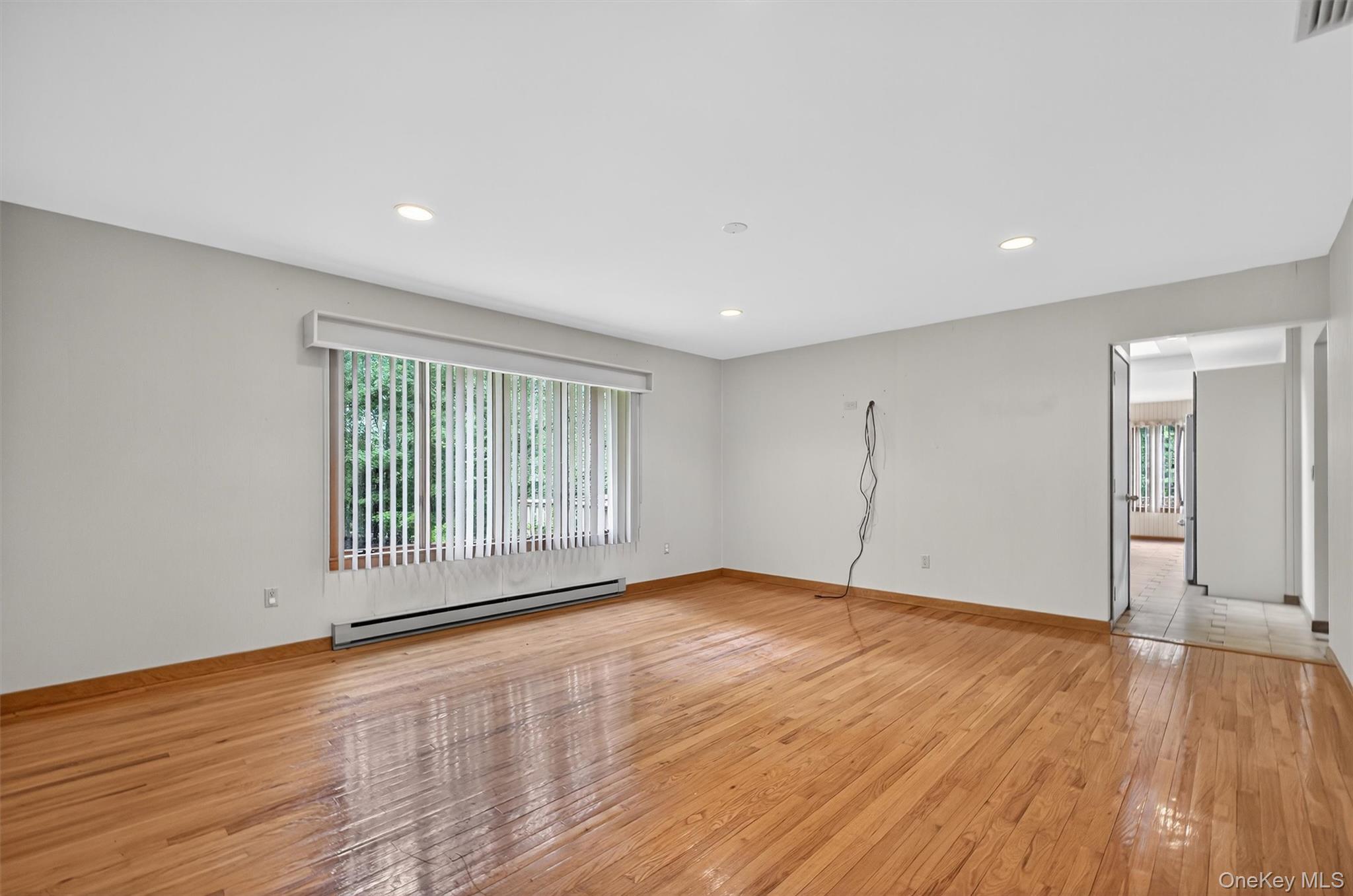 35 Greenlawn Road Amawalk, NY 10501 - Photo 5 of 50 a view of an empty room with wooden floor and a window