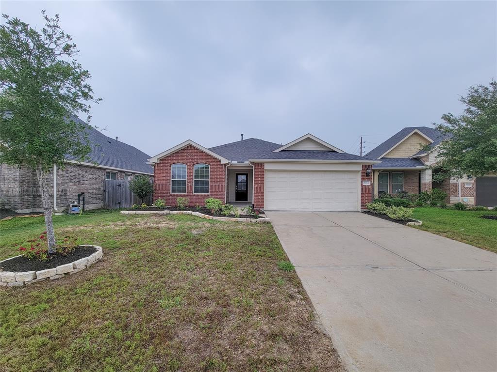 Welcome to 31114 Gulf Cypress Lane, featuring a beautifully landscaped front yard, situated in a serene cul-de-sac with a convenient two-car driveway.