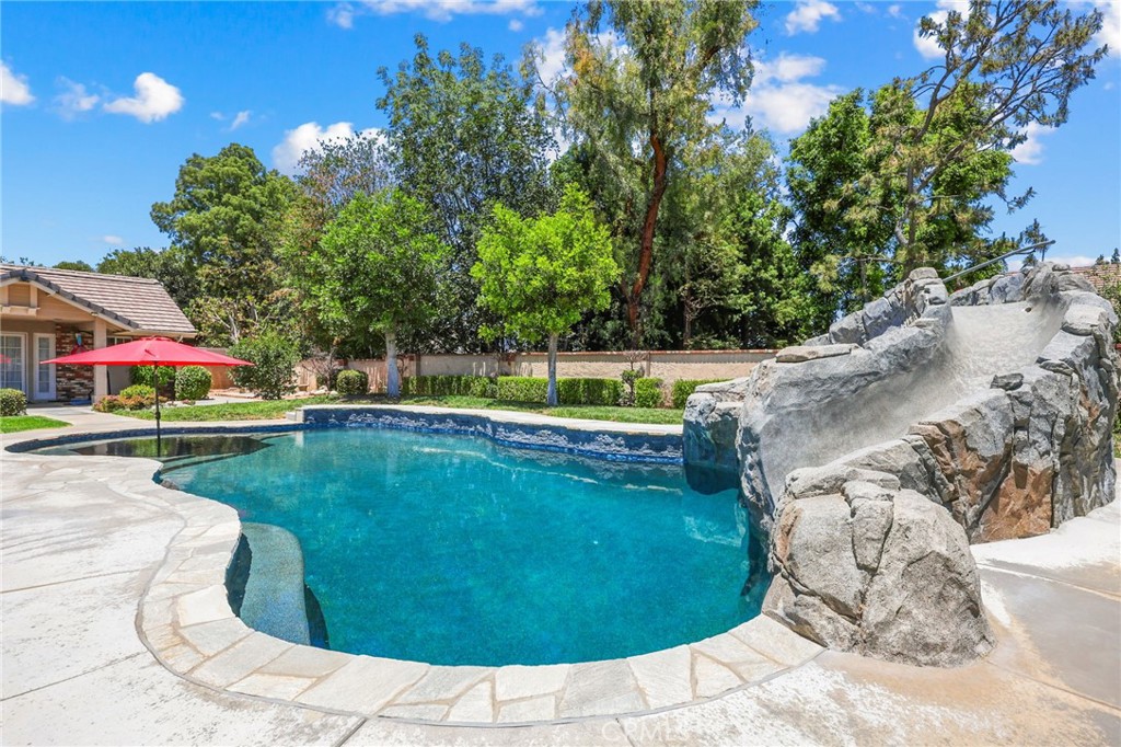 1657 Southport Drive Riverside, CA 92506 - Photo 34 of 41 POOL WITH SLIDE AND WATERFALL/CAVE