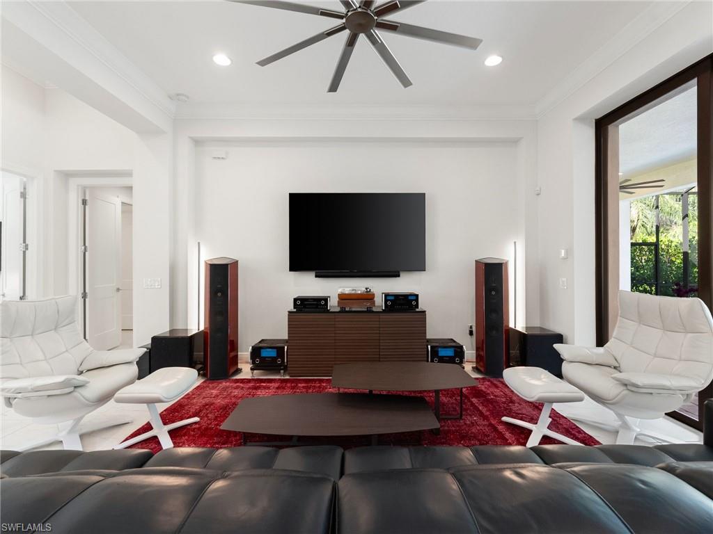 4199 11th Avenue Southwest Naples, FL 34116 - Photo 11 of 36 a bedroom with a bed and a flat screen tv