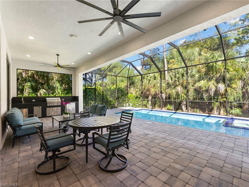 4199 11th Avenue Southwest Naples, FL 34116 - Photo 16 of 36 a view of a dining room with furniture window and outside view