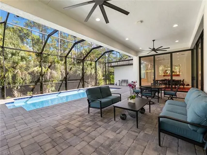a view of a swimming pool with seating area