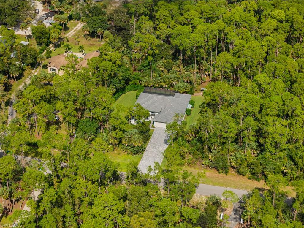 4199 11th Avenue Southwest Naples, FL 34116 - Photo 2 of 36 a view of a house with a yard