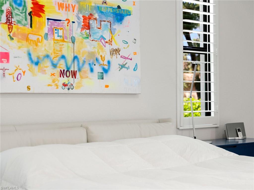 4199 11th Avenue Southwest Naples, FL 34116 - Photo 23 of 36 a bedroom with a bed and a window