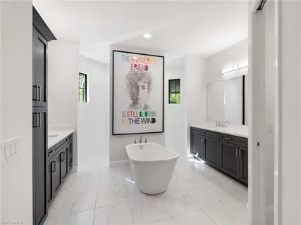 a bathroom with a sink and a white cabinet
