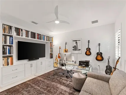 a bathroom with a toilet a sink a mirror and a bathtub