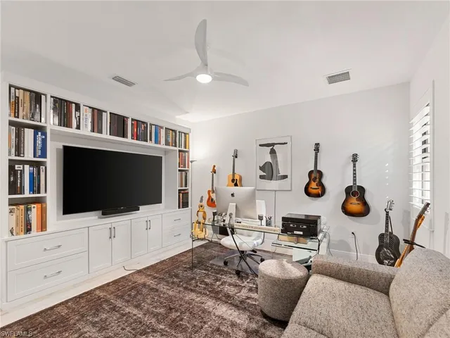 a bathroom with a toilet a sink a mirror and a bathtub