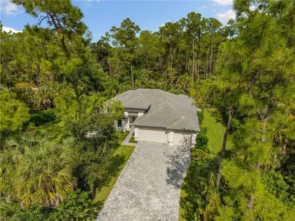 a aerial view of a house with a yard