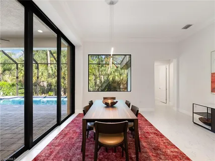 a view of a living room and dining room