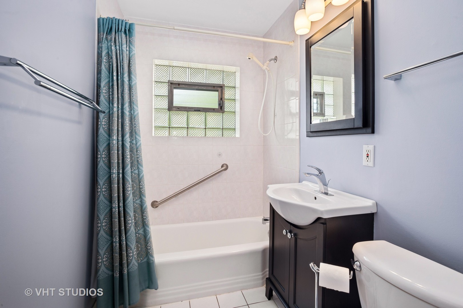 556 Pinehurst Drive Des Plaines, IL 60016 - Photo 11 of 18 a bathroom with a sink a toilet and shower