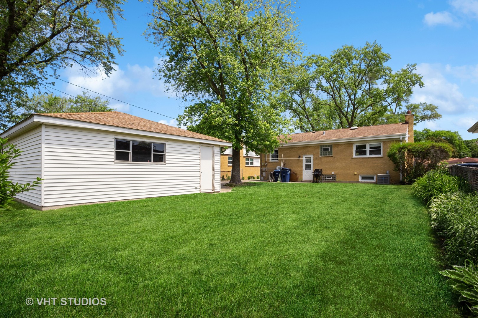 556 Pinehurst Drive Des Plaines, IL 60016 - Photo 16 of 18 a view of a house with a backyard