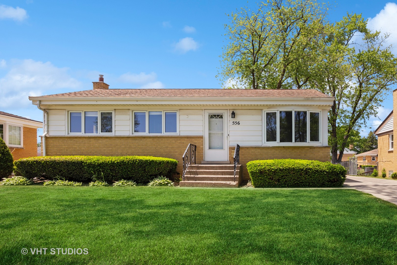556 Pinehurst Drive Des Plaines, IL 60016 - Photo 2 of 18 a front view of a house with a garden