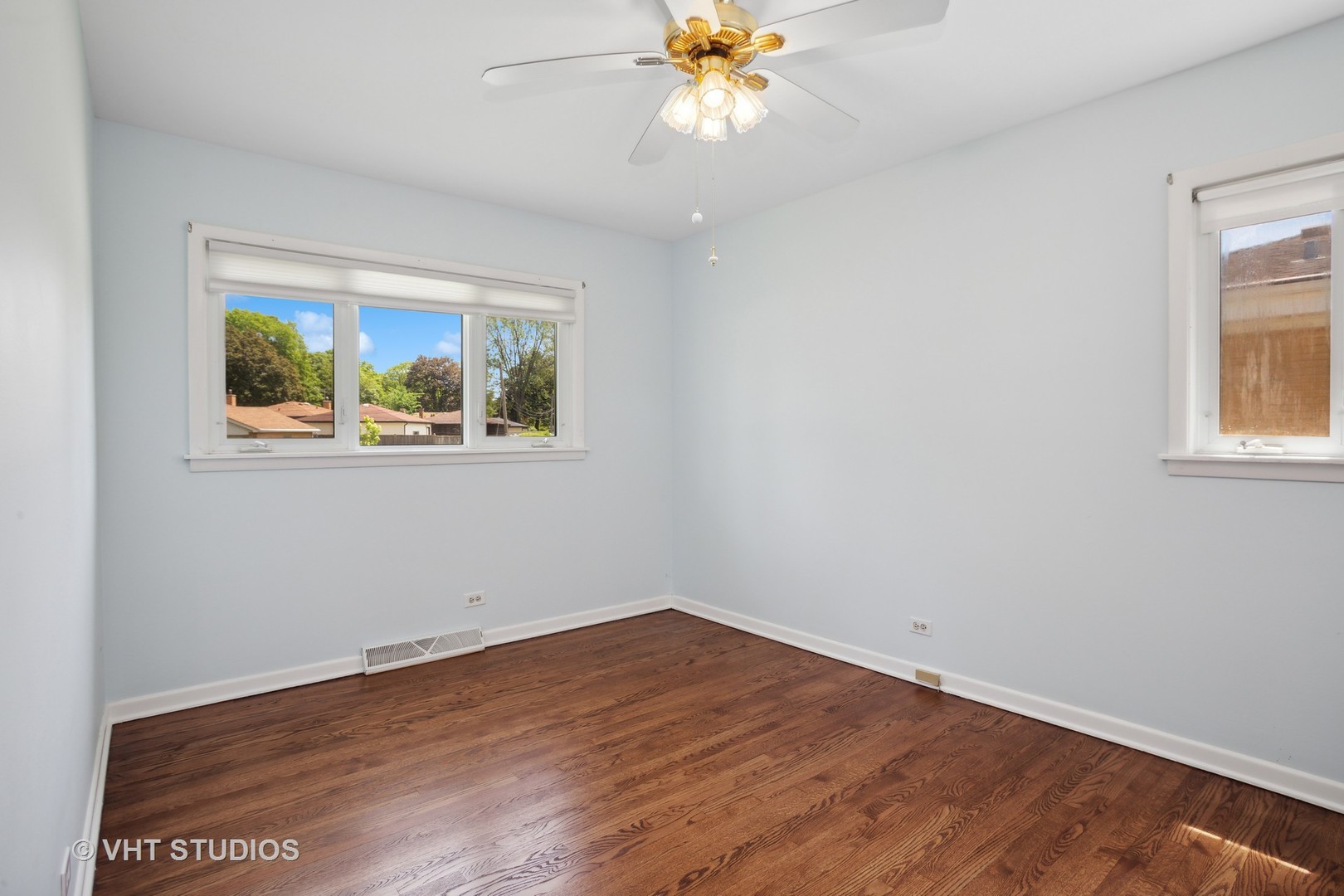 556 Pinehurst Drive Des Plaines, IL 60016 - Photo 8 of 18 a view of an empty room with wooden floor and a window