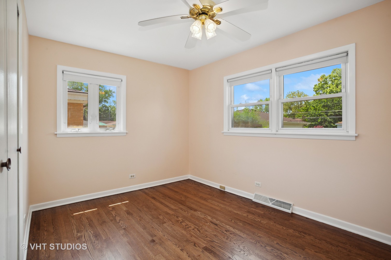 556 Pinehurst Drive Des Plaines, IL 60016 - Photo 10 of 18 a view of an empty room with wooden floor and a window