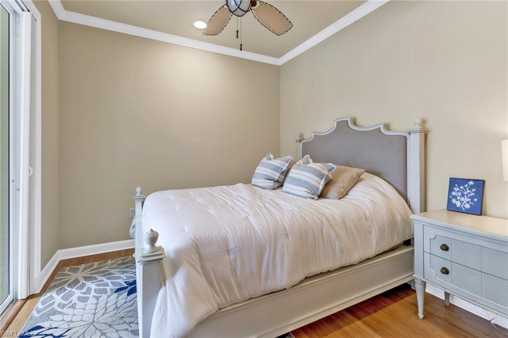 3157 Sundance Circle Naples, FL 34109 - Photo 40 of 50 Den being used as a bedroom. View of Pool and Lake.