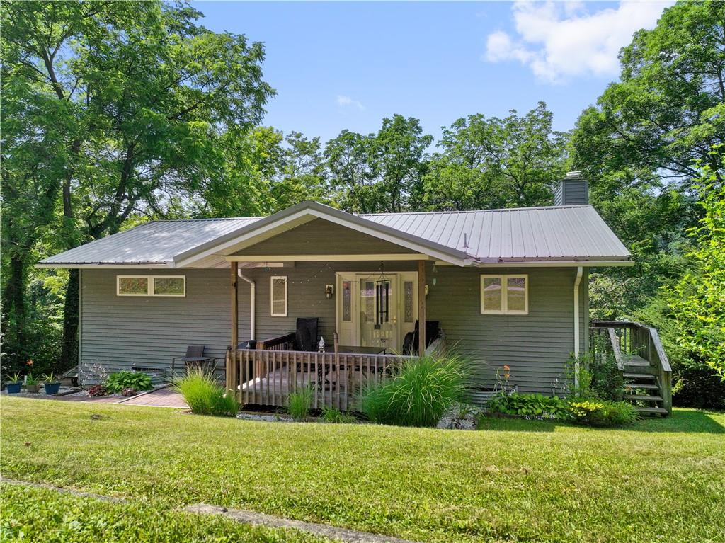 416 Lake Road Addison, PA 15411 - Photo 1 of 1 a front view of a house with a yard