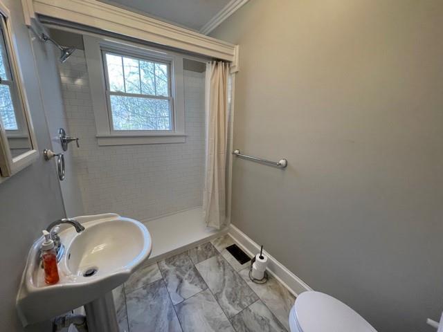 727 Lattimore Road Rutherfordton, NC 28139 - Photo 17 of 48 a bathroom with a sink toilet and shower