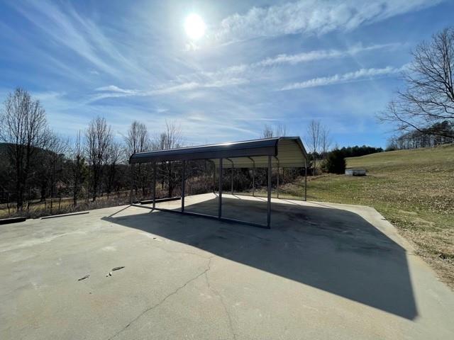 727 Lattimore Road Rutherfordton, NC 28139 - Photo 44 of 48 a swimming pool with outdoor seating and yard