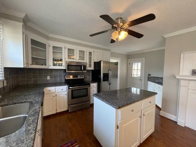727 Lattimore Road Rutherfordton, NC 28139 - Photo 6 of 48 a kitchen with stainless steel appliances granite countertop a sink dishwasher stove and refrigerator with wooden floor