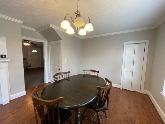 727 Lattimore Road Rutherfordton, NC 28139 - Photo 9 of 48 a dining room with wooden floor a chandelier a wooden table and chairs