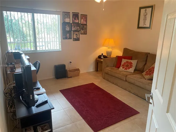 a living room with furniture and a window