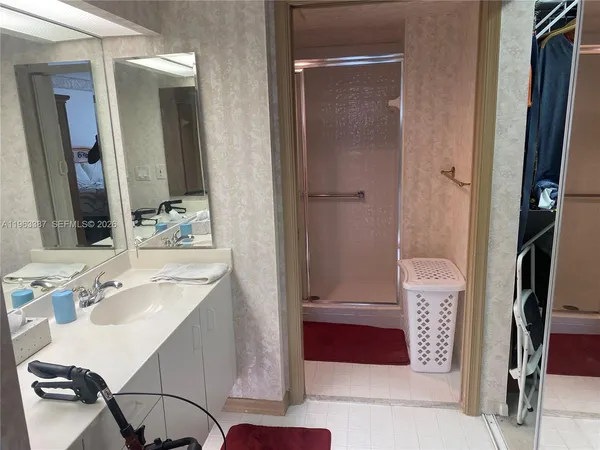 a bathroom with a sink double vanity and a mirror