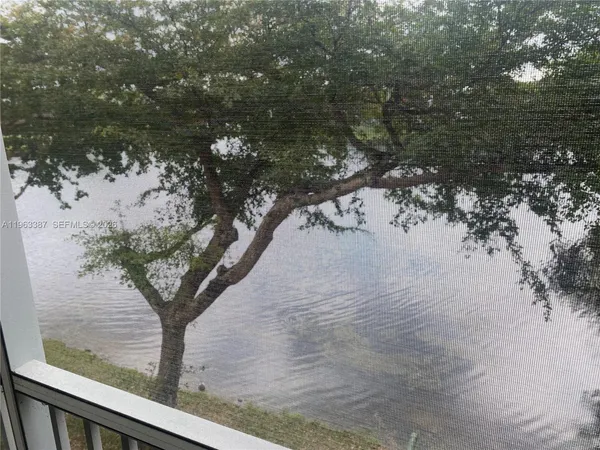 a view of mountain view with large trees