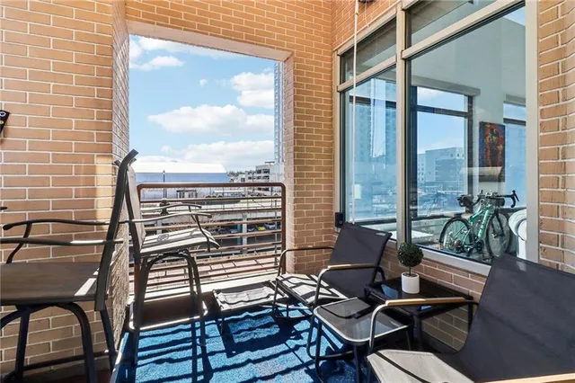 a view of a balcony with chairs