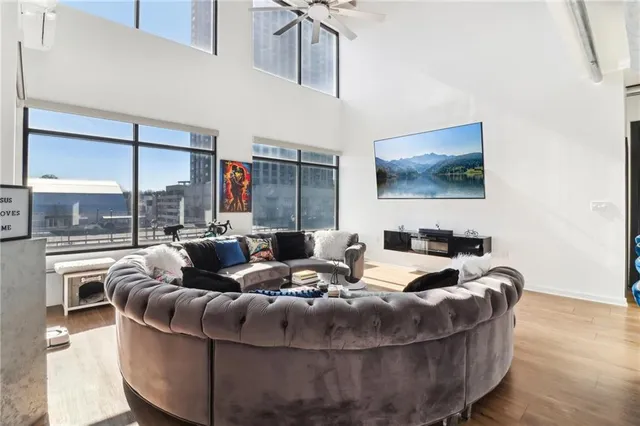 a living room with furniture and a flat screen tv