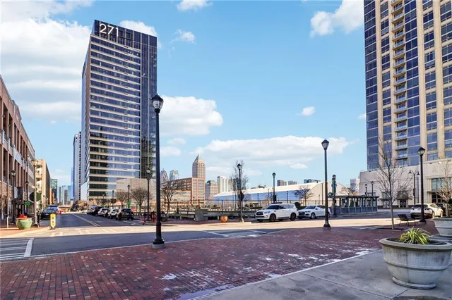 a view of a chairs and tables in the patio with a yard