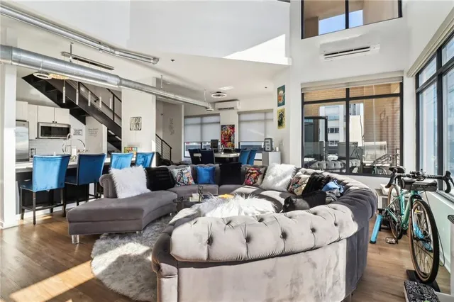 a living room with furniture and a large window