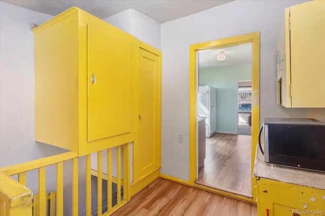 a view of an entryway with wooden floor