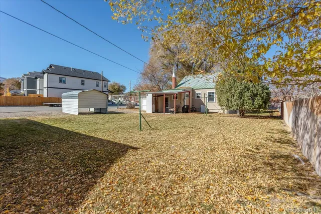 an aerial view of a house with a lake view