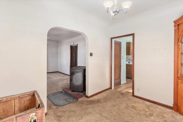 a view of front door with wooden door
