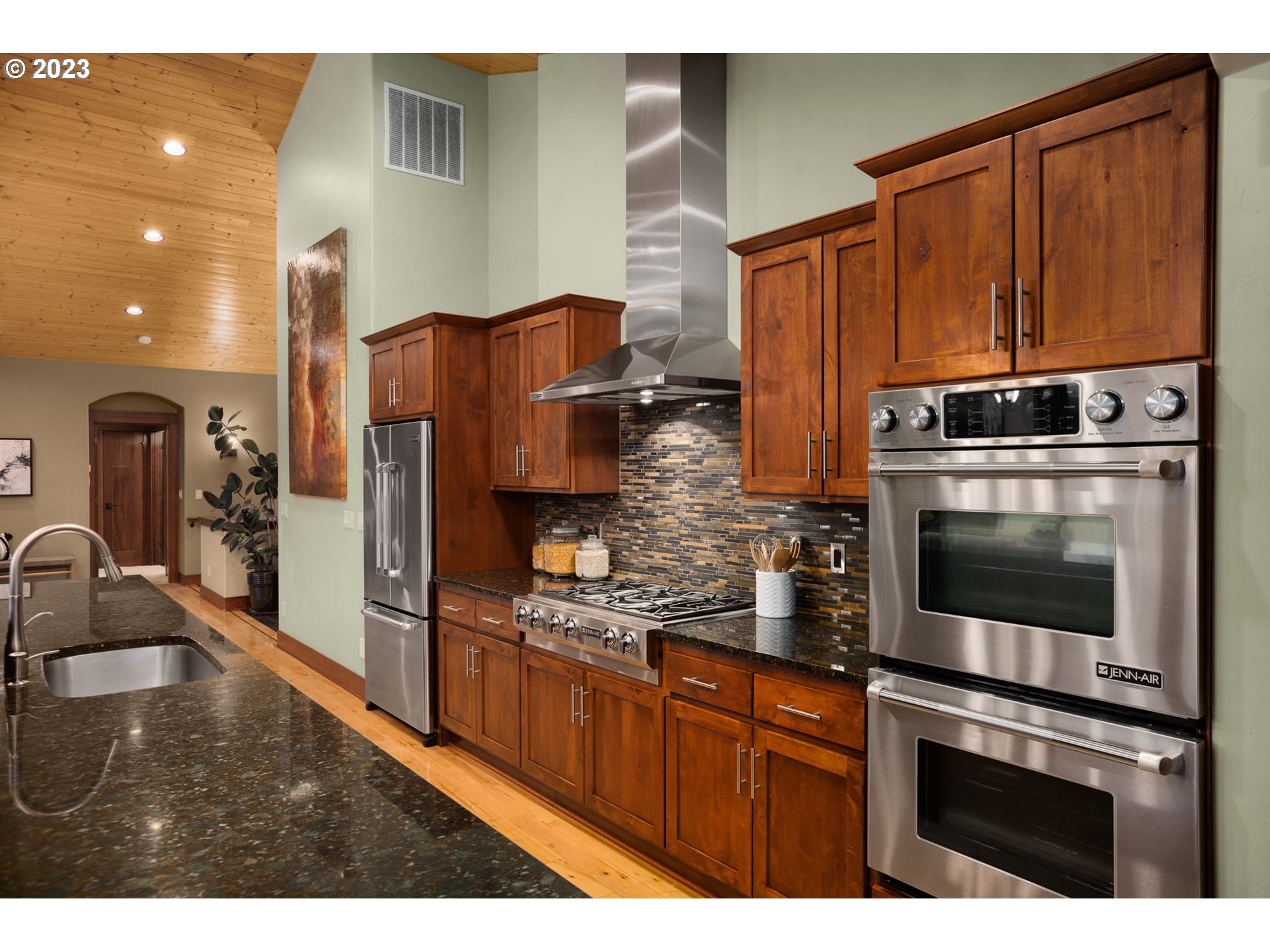 1575 Nunamaker Road Hood River, OR 97031 - Photo 12 of 48 a kitchen with stainless steel appliances granite countertop a refrigerator and a stove top oven