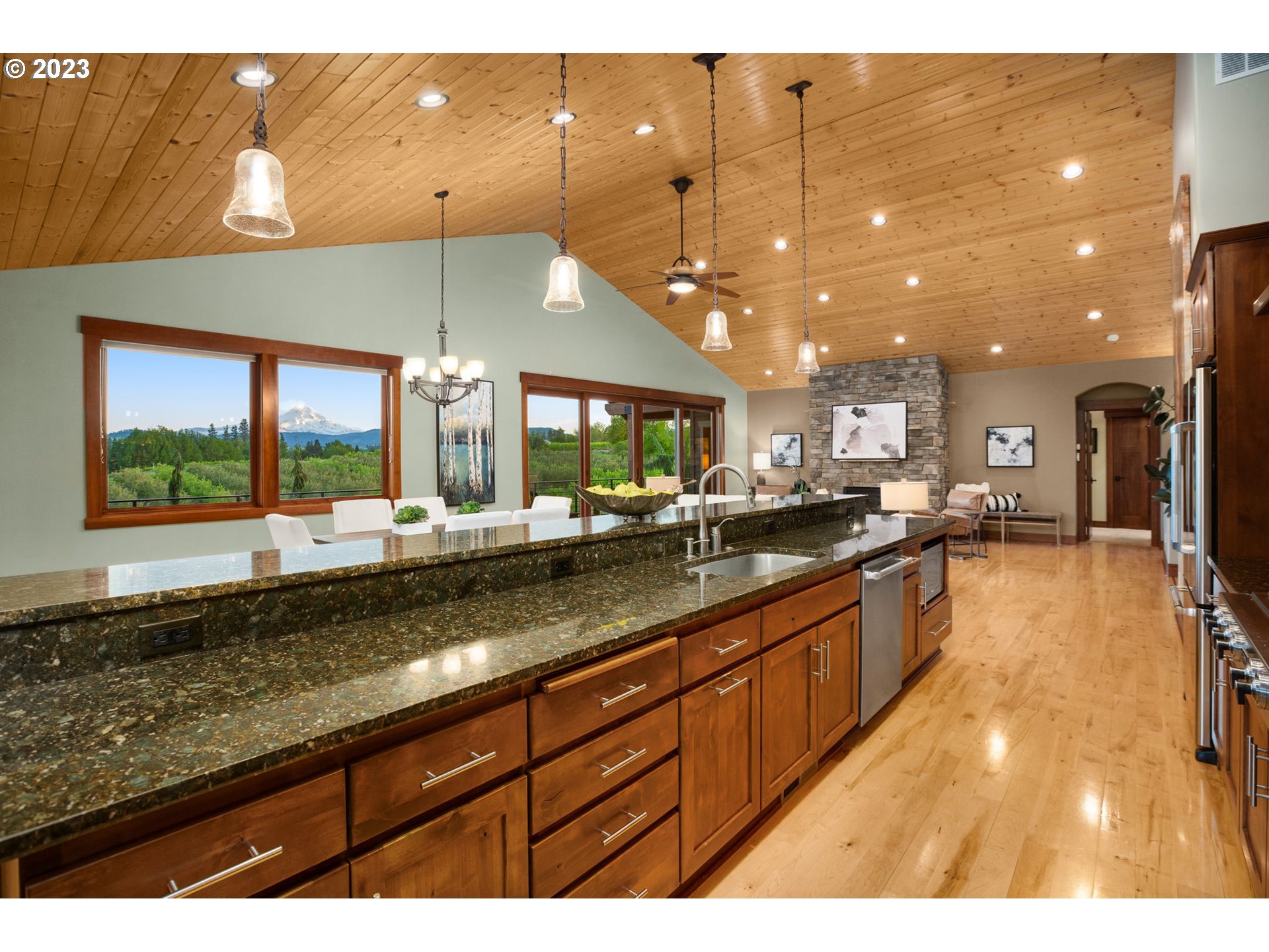 1575 Nunamaker Road Hood River, OR 97031 - Photo 13 of 48 a large kitchen with kitchen island a large window in it